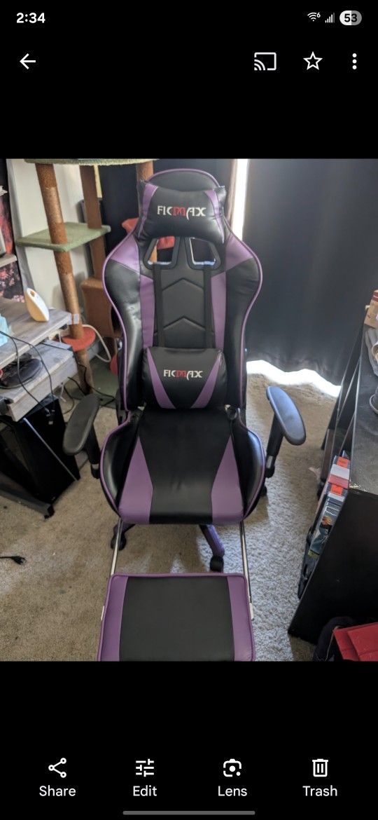 Reclining gaming chair with leg rest