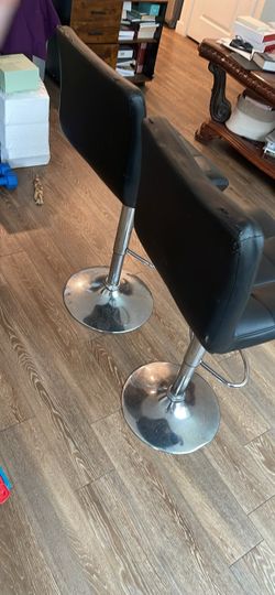 Black faux-leather swivel barstools