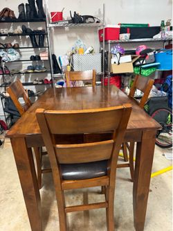 Walnut dining table with four chairs