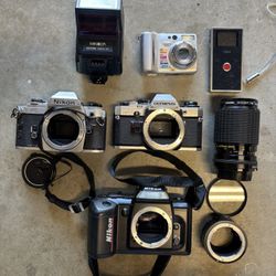 4 Camera Body  one Lens and accessories for Parts or Repair , make an offer .