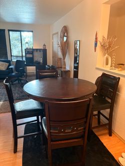 Round Dining Table + 4 Chairs – $100