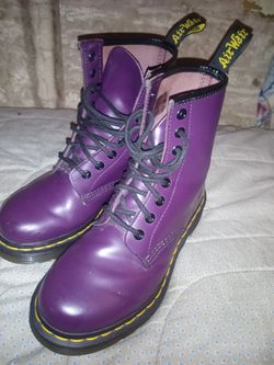 Dr. Martens 1460 8-Eye Boots in a bright purple patent leather finish.