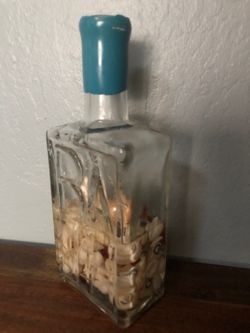 Decorative bottle with sea shells for bath