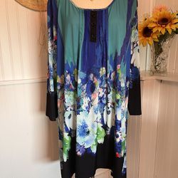 Scooped neckline adorns this gorgeous multitude of colors Tunic