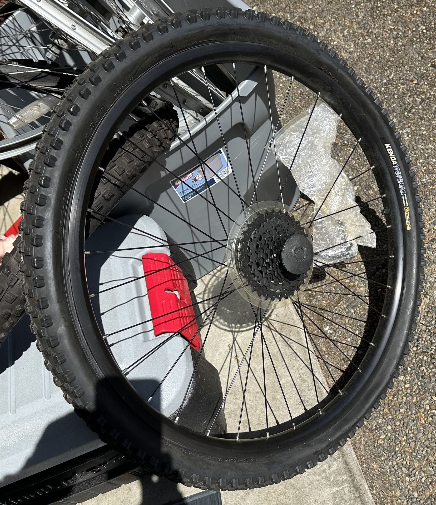 Giant factory 26” replacement rear wheel New. 8speed cassette with quick release ( in the plastic rapper in the spokes. With new Kenda Nevegal tire (