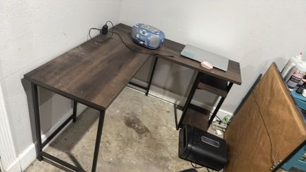 L-Shaped Computer Desk with Shelves has some wear and tear