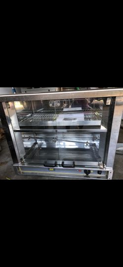 Rotisserie oven brand new never used holds up to 4 standard size chickens
