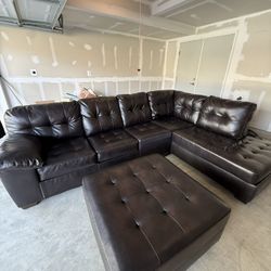 Black leather sectional With Ottoman 