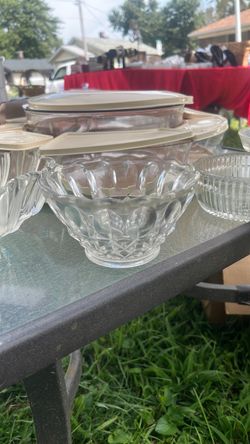 vintage pressed or cut clear glass decorative bowl featuring a scalloped rim and geometric star-like patterned base.
