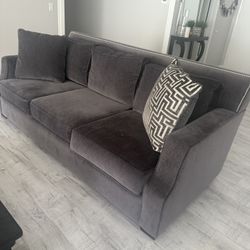 Couch With Silver Nail Trim Detail