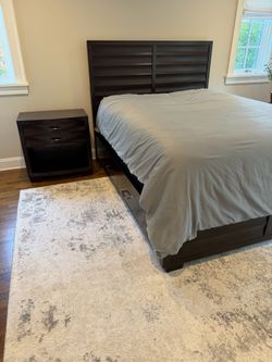 Queen sized dark wood shutter style storage bed and nightstand VG condition  Mattress and box spring is included