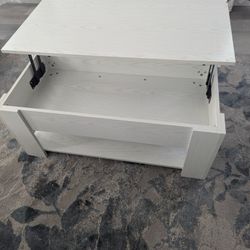 Nice coffee table with compartment with lid.