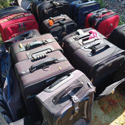 LOTS OF NICE PULL ALONG LUGGAGE 