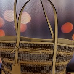 Gorgeous and spacious purse by Dana Buchman. Material leather and fabric. 14x13"inches. Beautiful color and design. Please read and see the pictures f