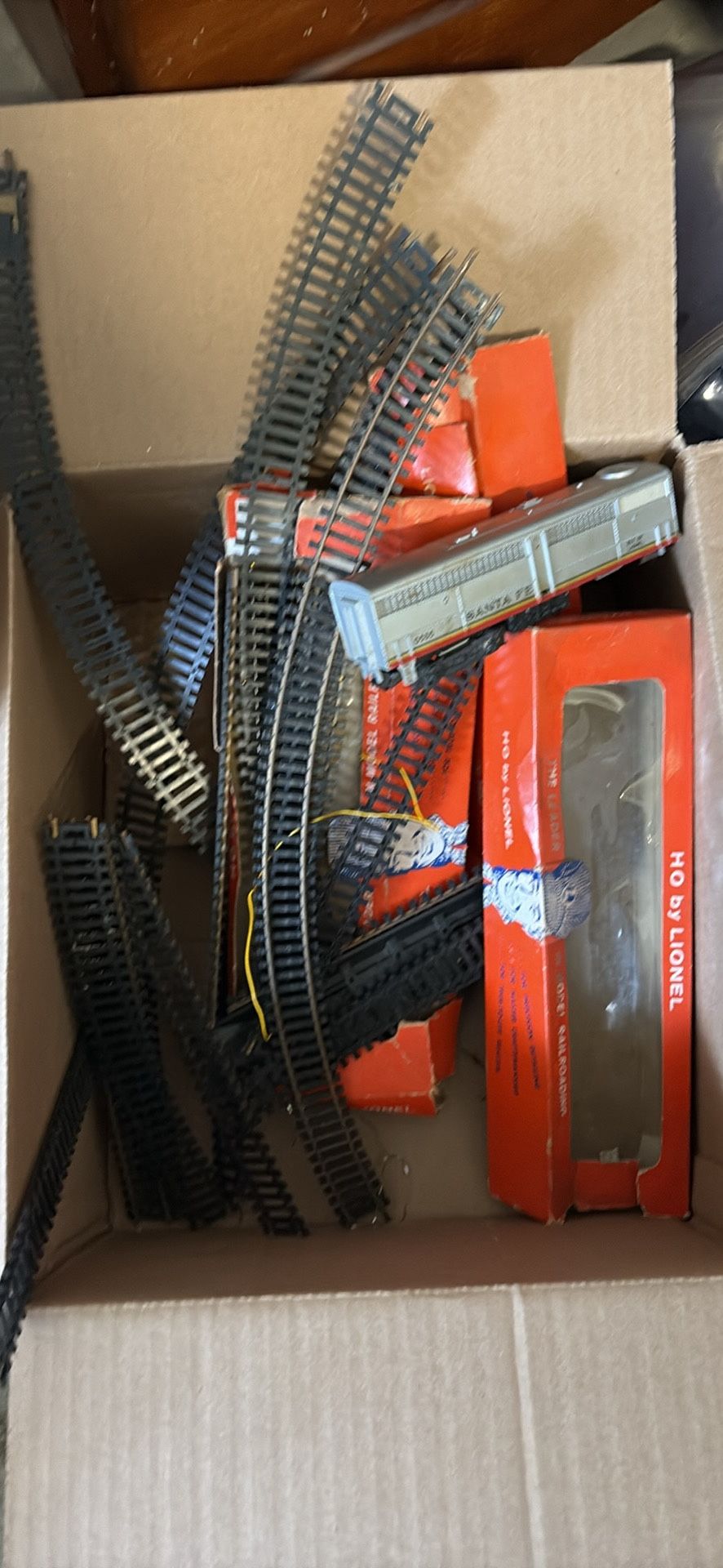 Box Of Lionel Train Tracks And One Train 
