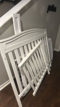 White Wood Baby Crib Disassembled