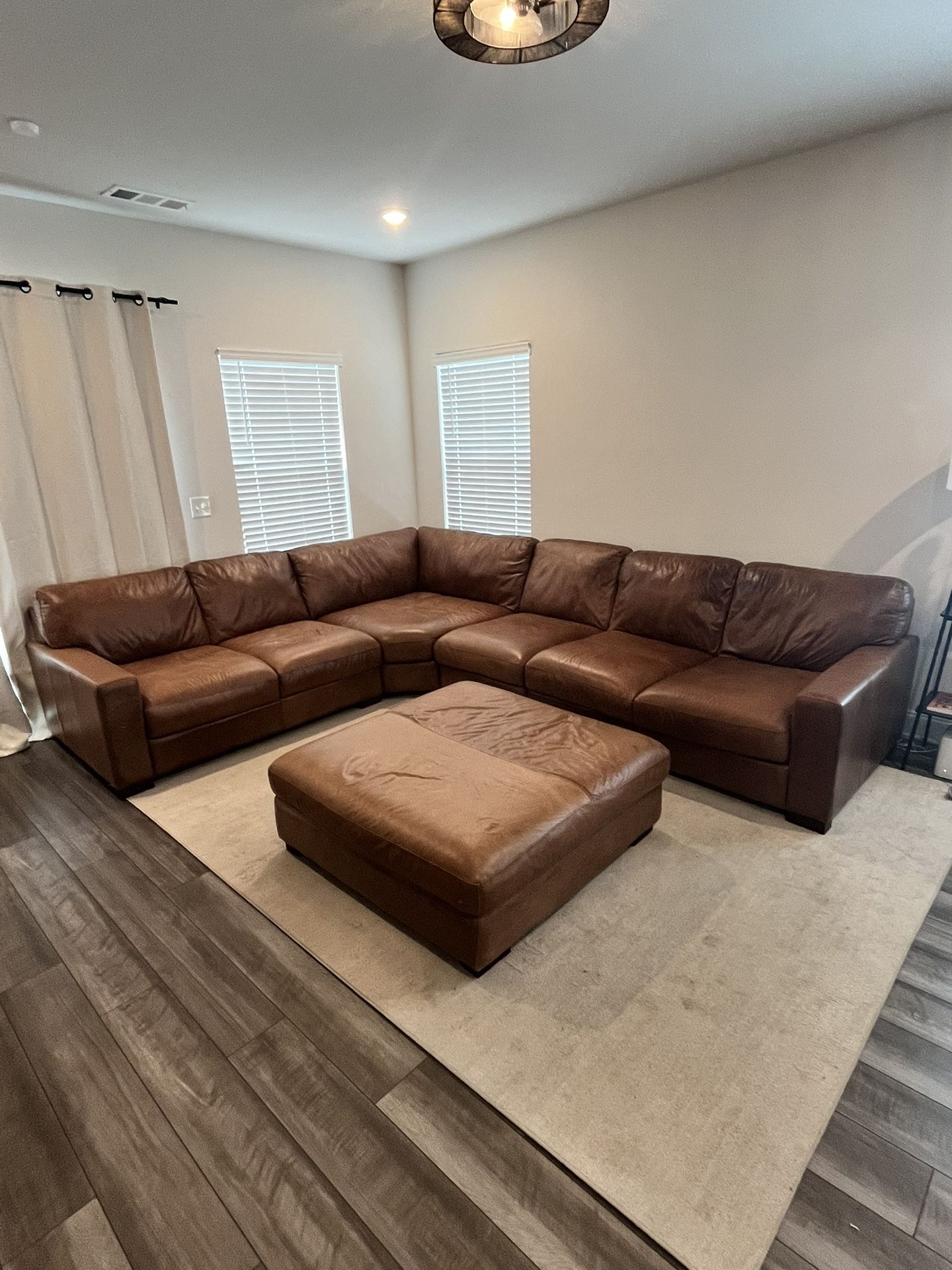 Almost Brand New Real Leather 6 Seat Sectional + Ottoman for Sale in