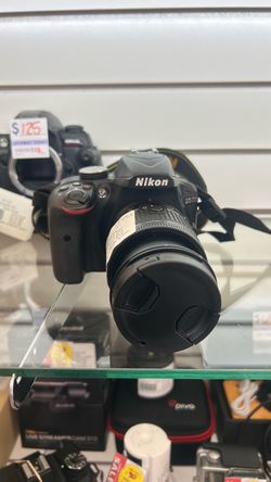 Nikon DSLR Camera with Lens