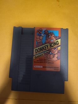 This is a Nintendo Entertainment System game cartridge for Donkey Kong Classics, which includes both Donkey Kong and Donkey Kong Jr. [5.11, 5.12].