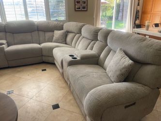 Sectional sofa with three recliners