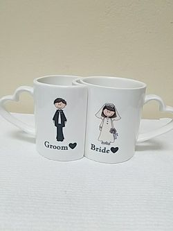 Bride & groom attached mugs with heart shaped handles