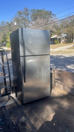 Silver refrigerator GE model