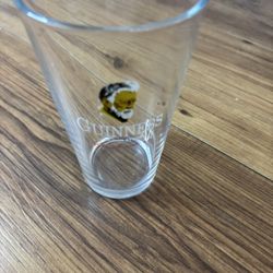 Official Guinness pint glass, featuring the classic logo with the harper graphic