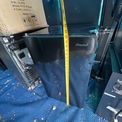 Mini household refrigerator. Built-in freezer compartment.