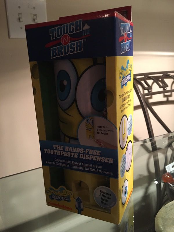 Children's hands free toothpaste dispenser