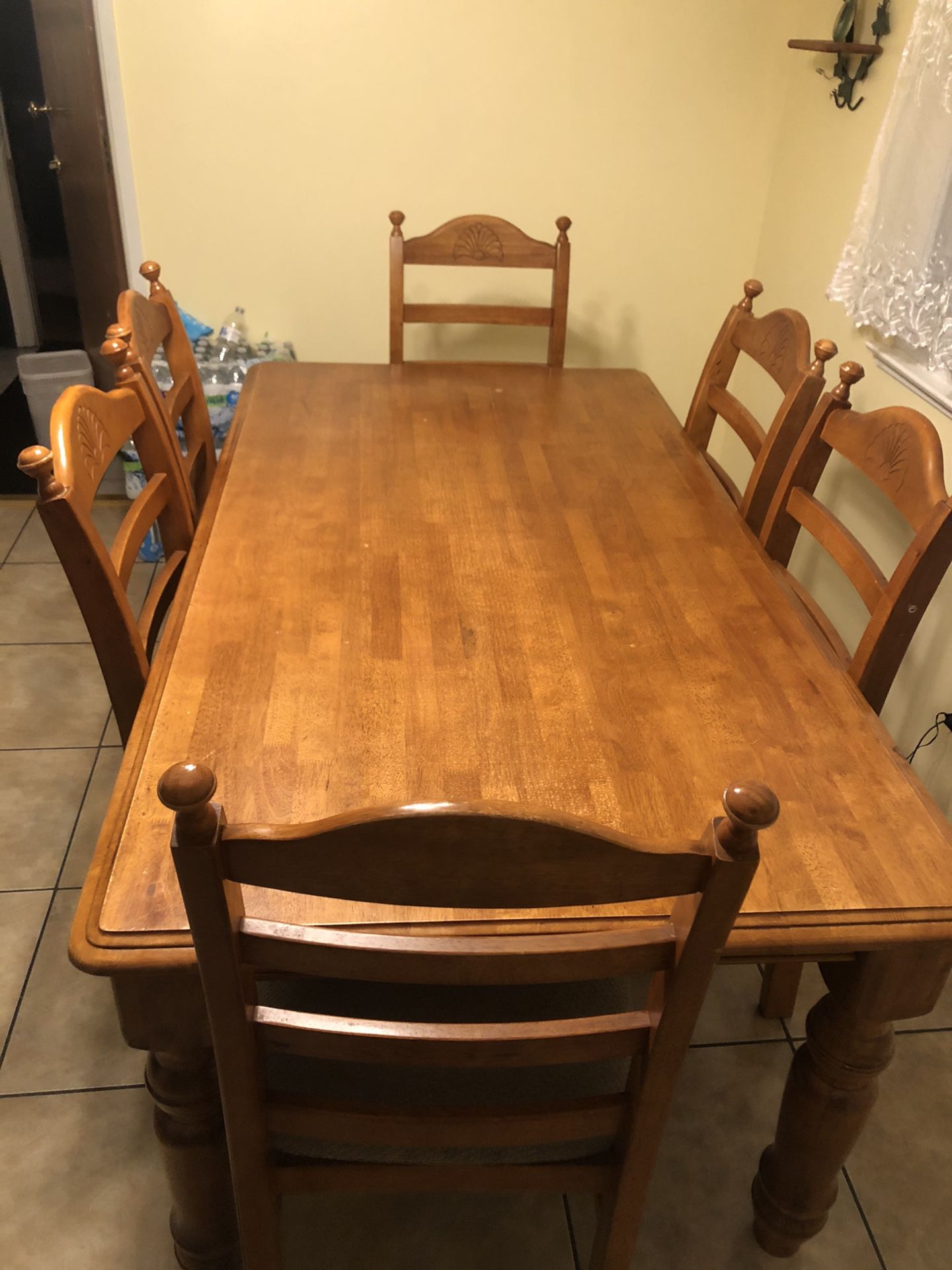 Wooden Dining table with chairs.