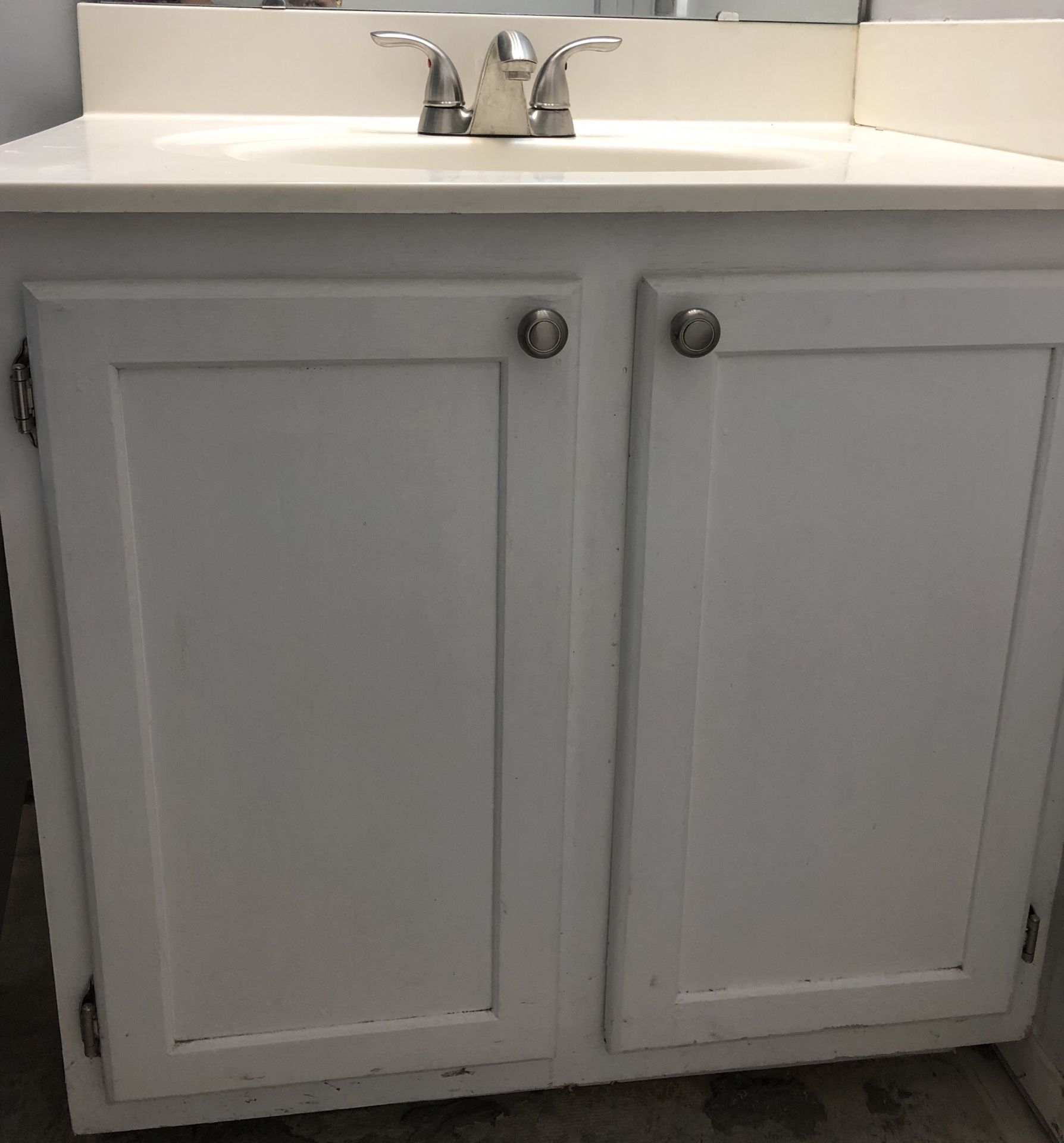 Bathroom vanity. Includes cabinet, sink and faucet.