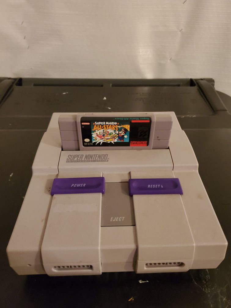 Super Nintendo with games and controllers