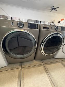 GE font load washer and electric dryer set