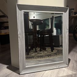 Grey framed mirror