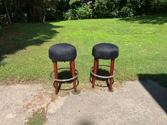 Set of two wooden bar stools with cushion seats