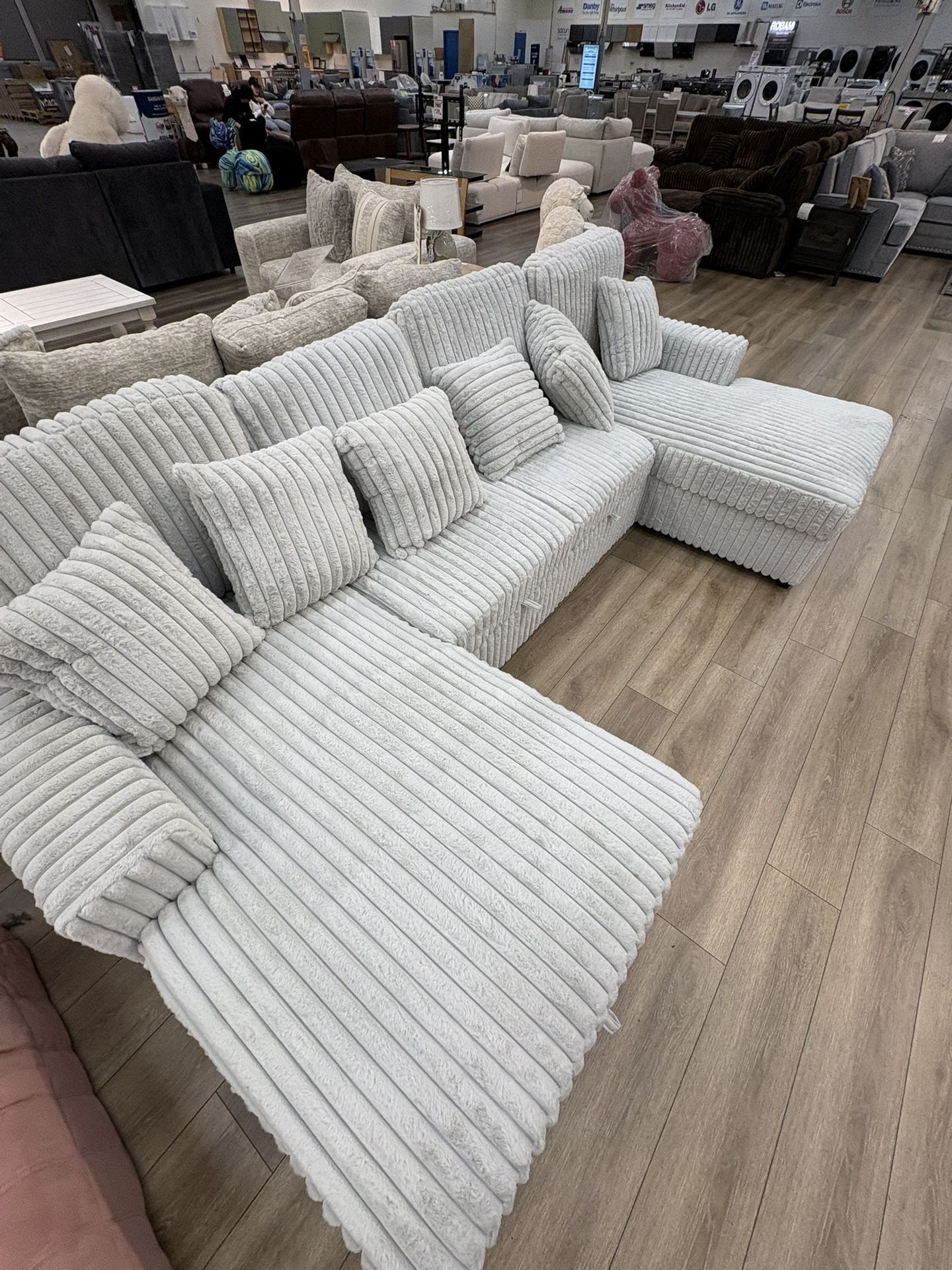 NEW SILVER CORDUROY SOFA WITH PULL OUT SOFA AND DOUBLE STORAGE CHAISE
