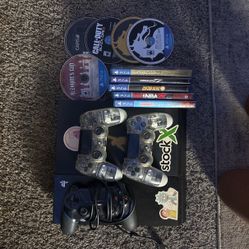 PS4 With Controllers And Games