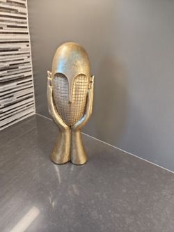 Contemporary gold mask art piece