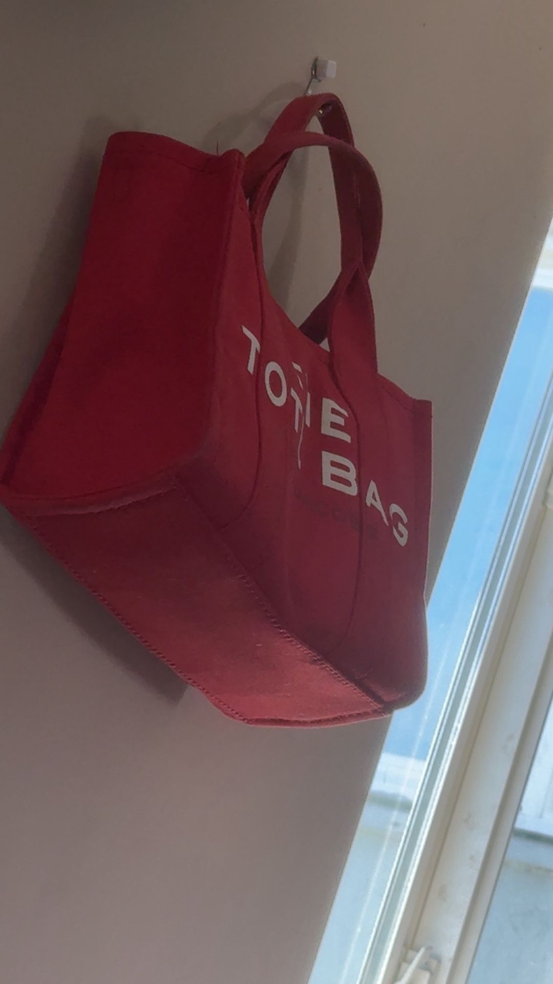 red marc jacob’s tote bag