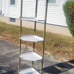 White and gold corner shelf unit. Wood shelves 
$65 pickup only in Cranston