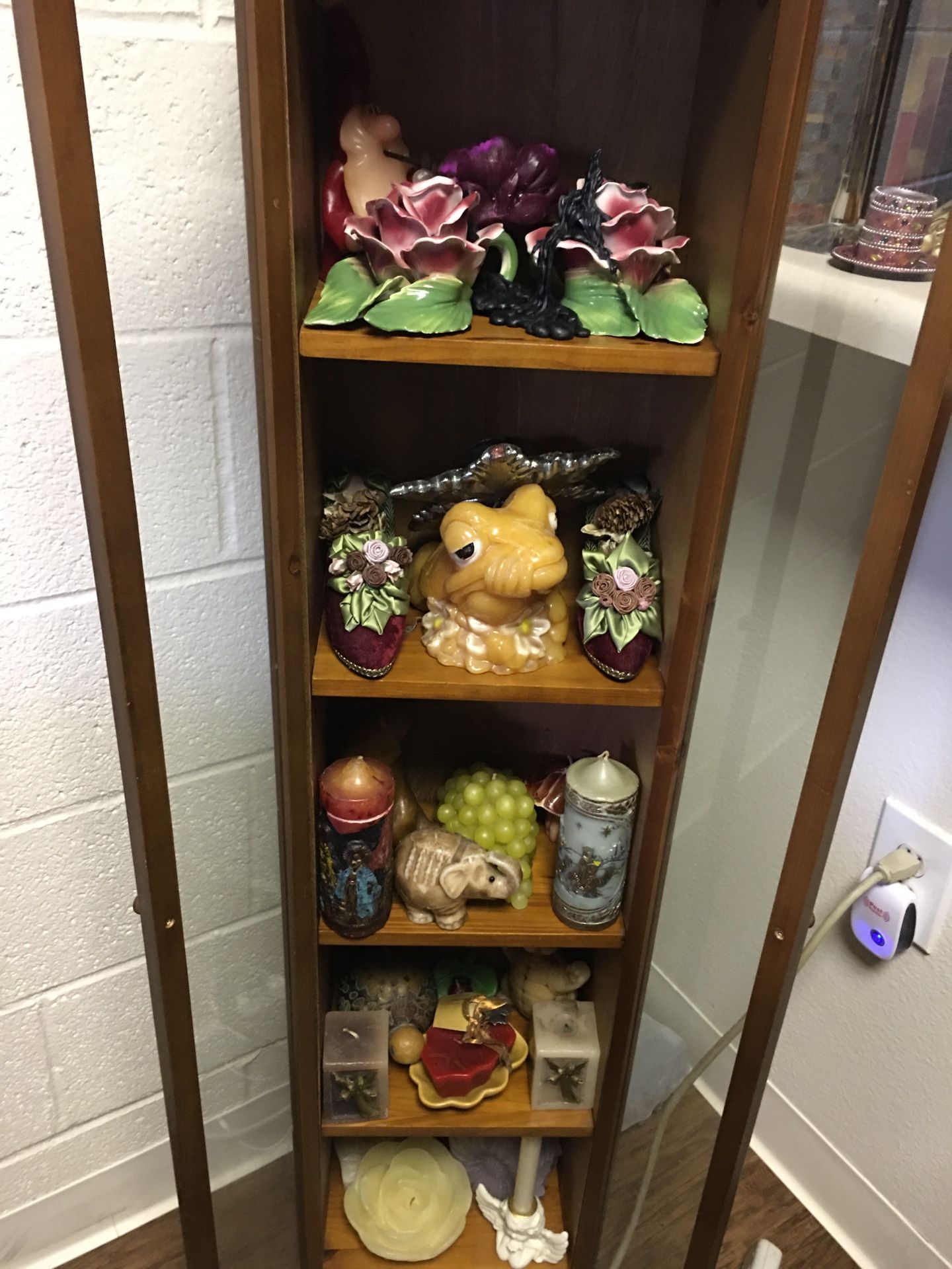 Antique cabinet with amazing candle collection