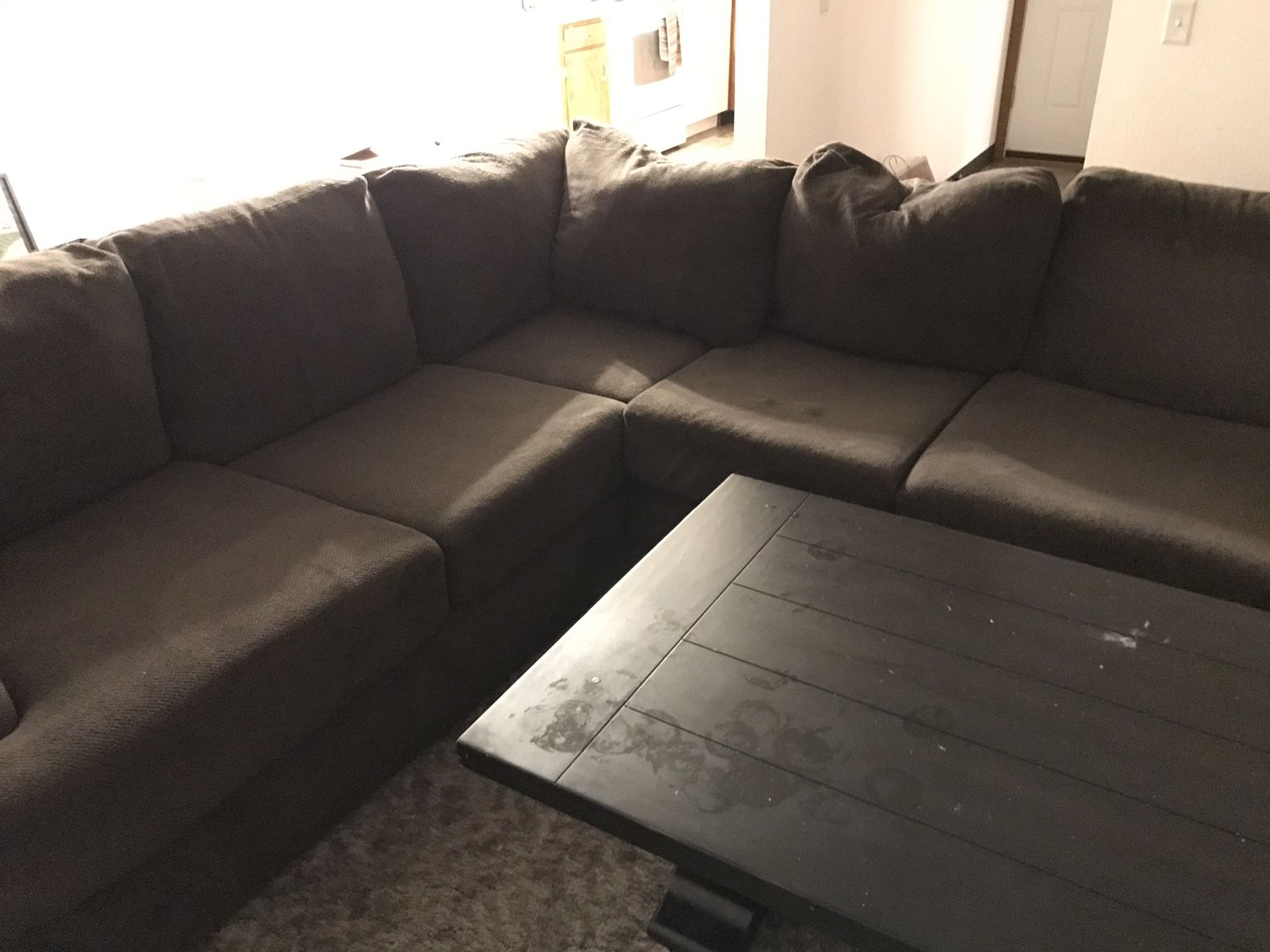Huge sectional and coffee table. Used