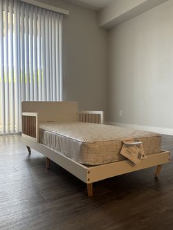 Delta Children Logan Wood Toddler Bed + Sealy Mattress
