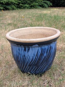 Large outdoor ceramic plant pot with drainage holes