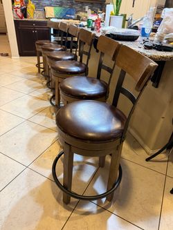 set of 6 slightly used heavy rustic hardwood counter height bar stool