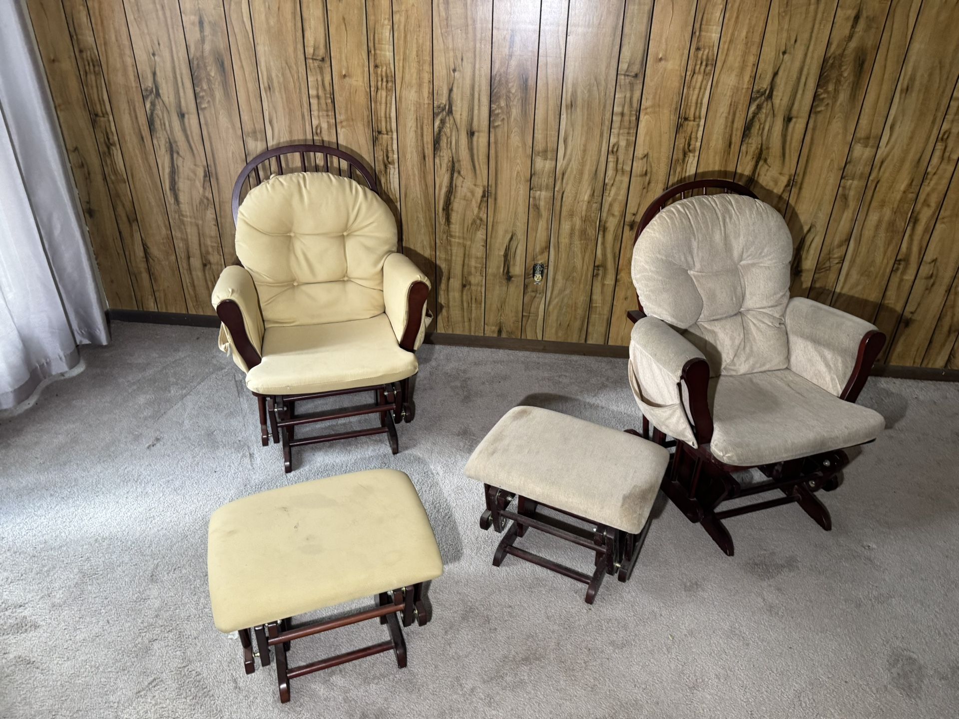 Two rocking chairs with ottomans