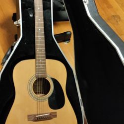 A Classic Guitar And Case