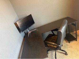 Desk with chair and gaming monitor