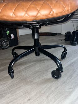 Brown leather swivel desk chair