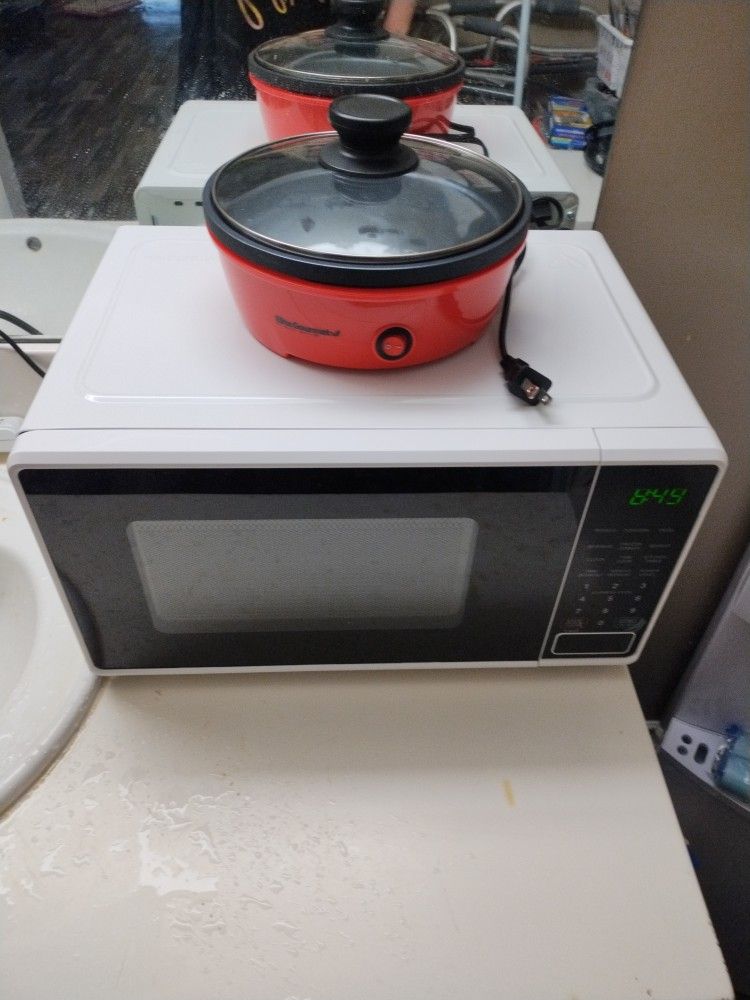 White And Black Microvave And Red 2 Person Griddle Both Are In Very Good Condition Griddle Is Only 3 Days Old Only Been Used Once Selling Both Applian